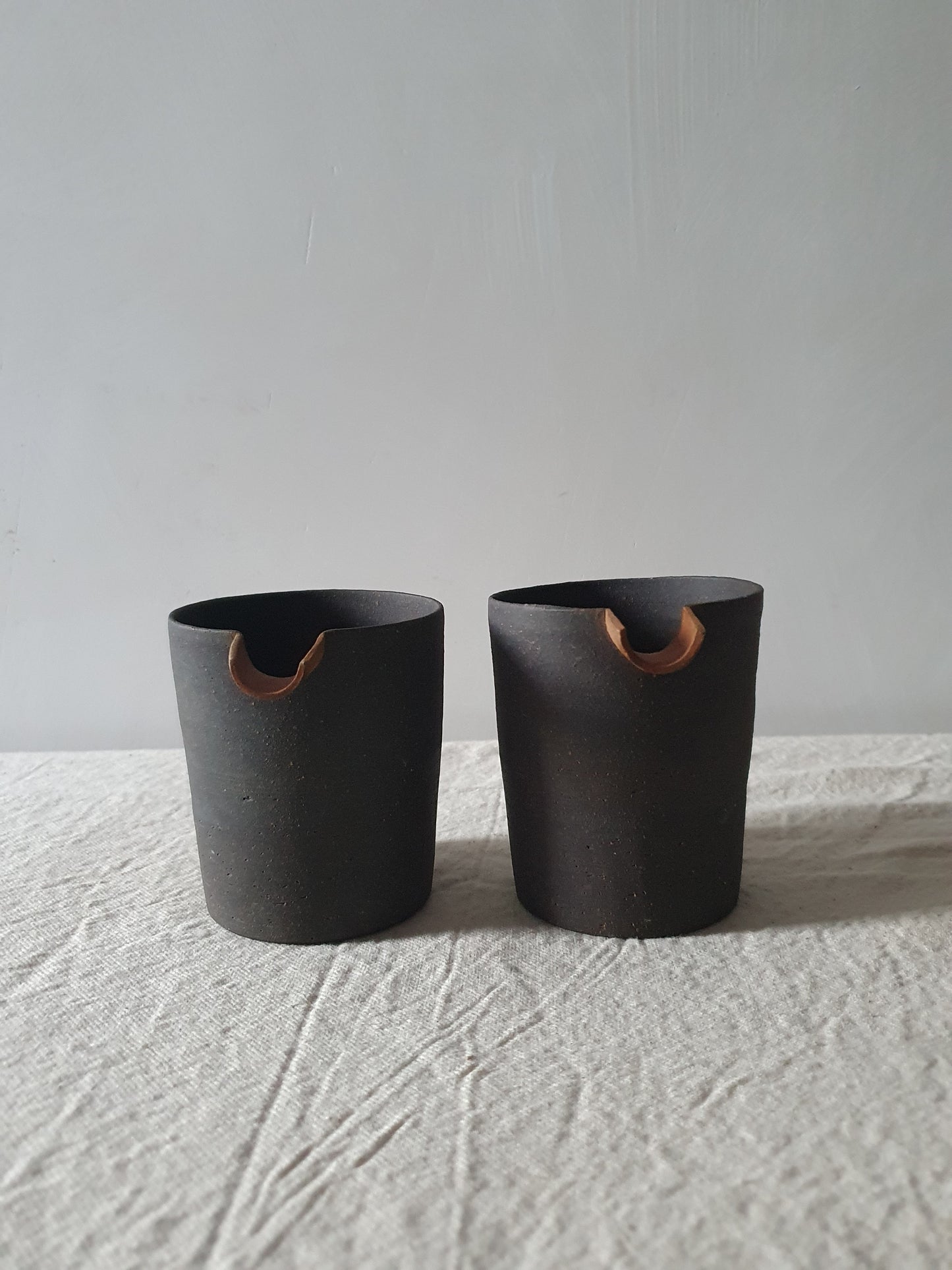 Blackened Tan Pottery Jug