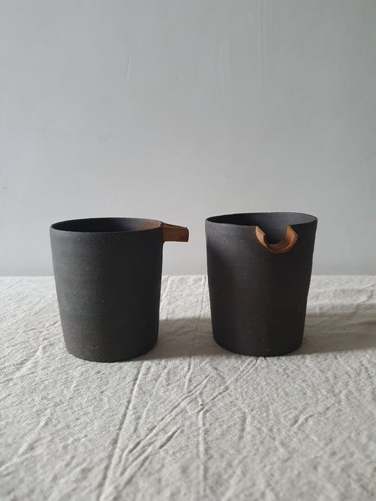 Blackened Tan Pottery Jug