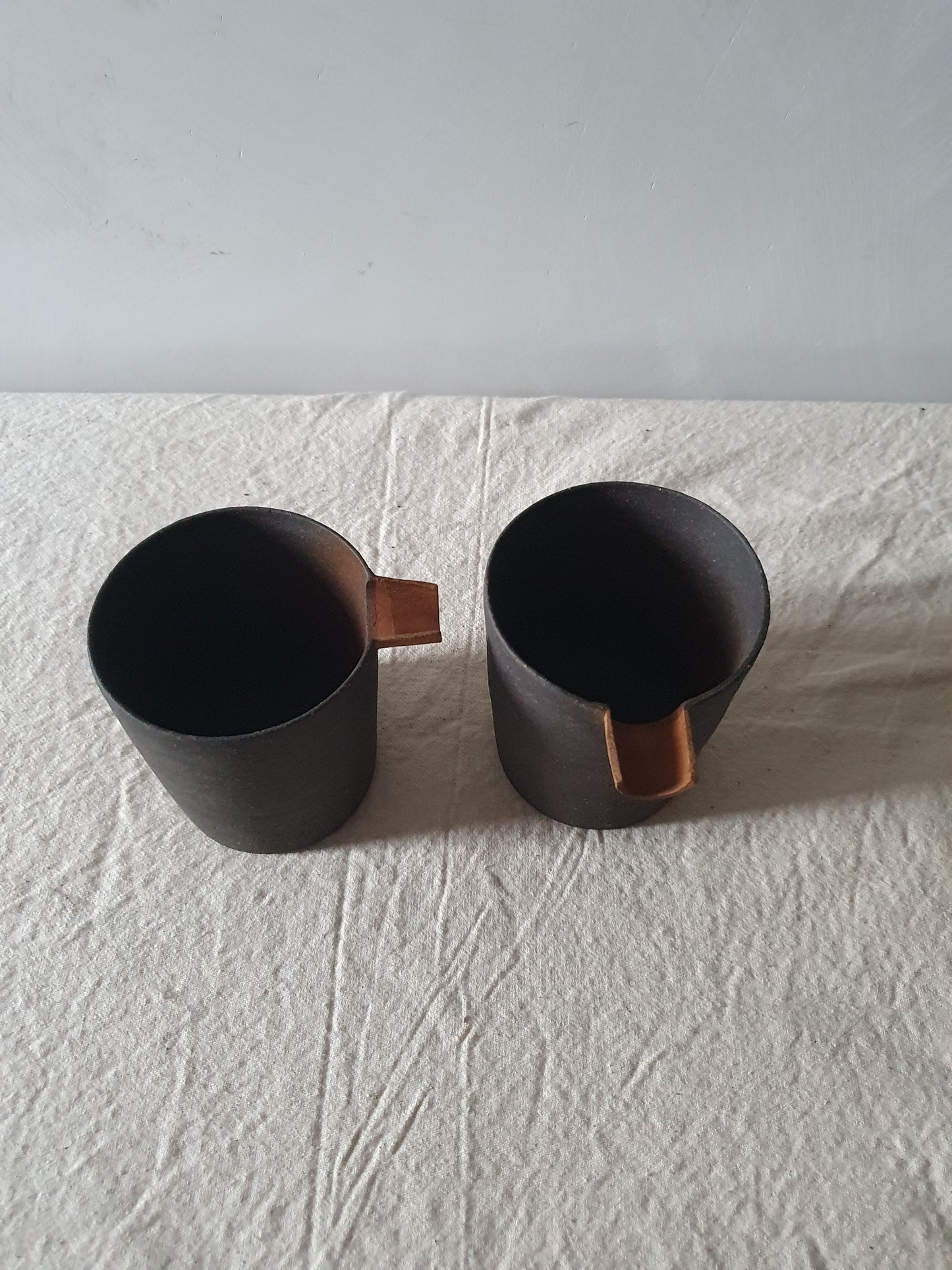 Blackened Tan Pottery Jug