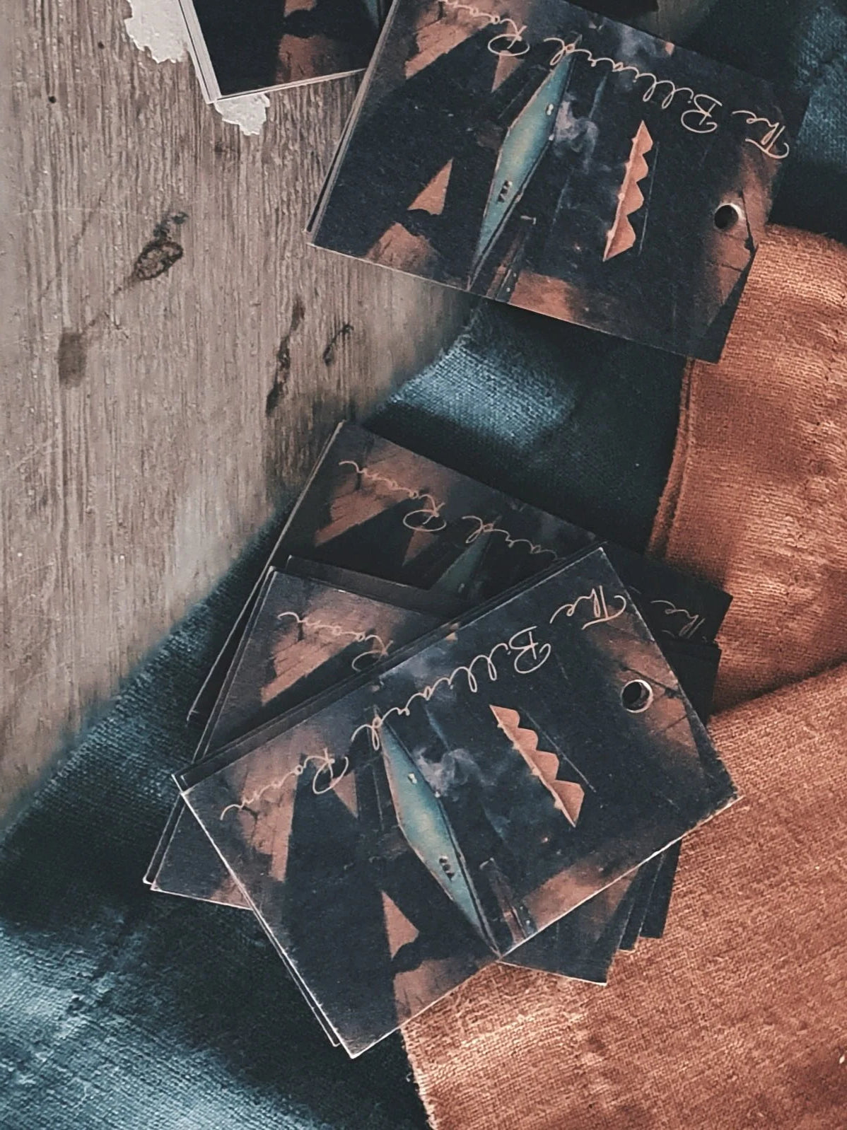 Set of cards with scenic designs on a textured surface
