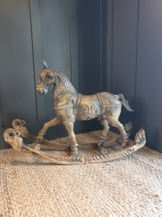 Decorative carved wooden rocking horse