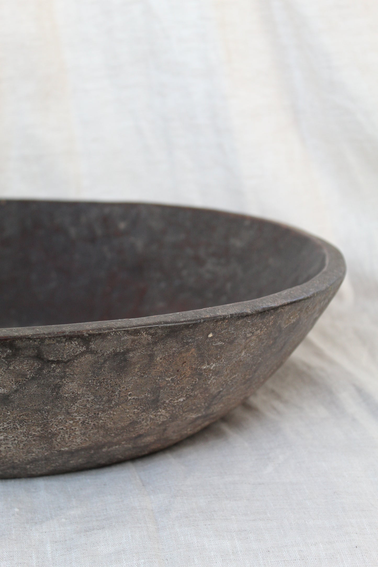 Close-up of a wooden bowl on a white background
