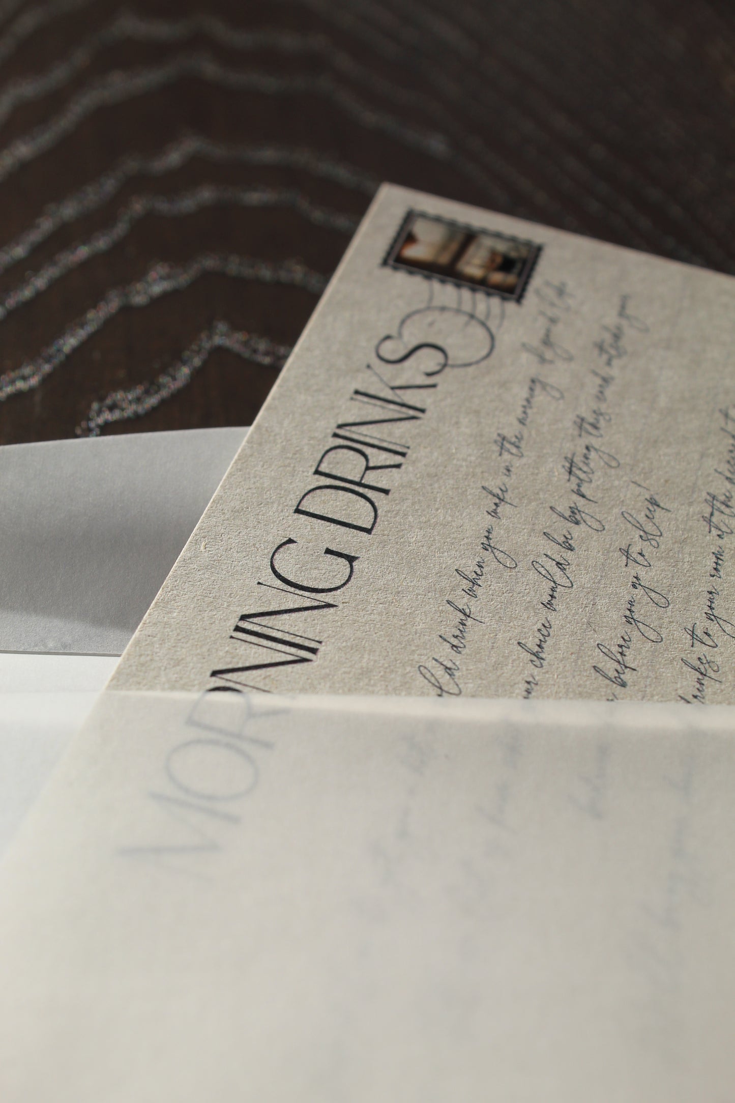 Close-up of a menu with text and a logo on a wooden surface
