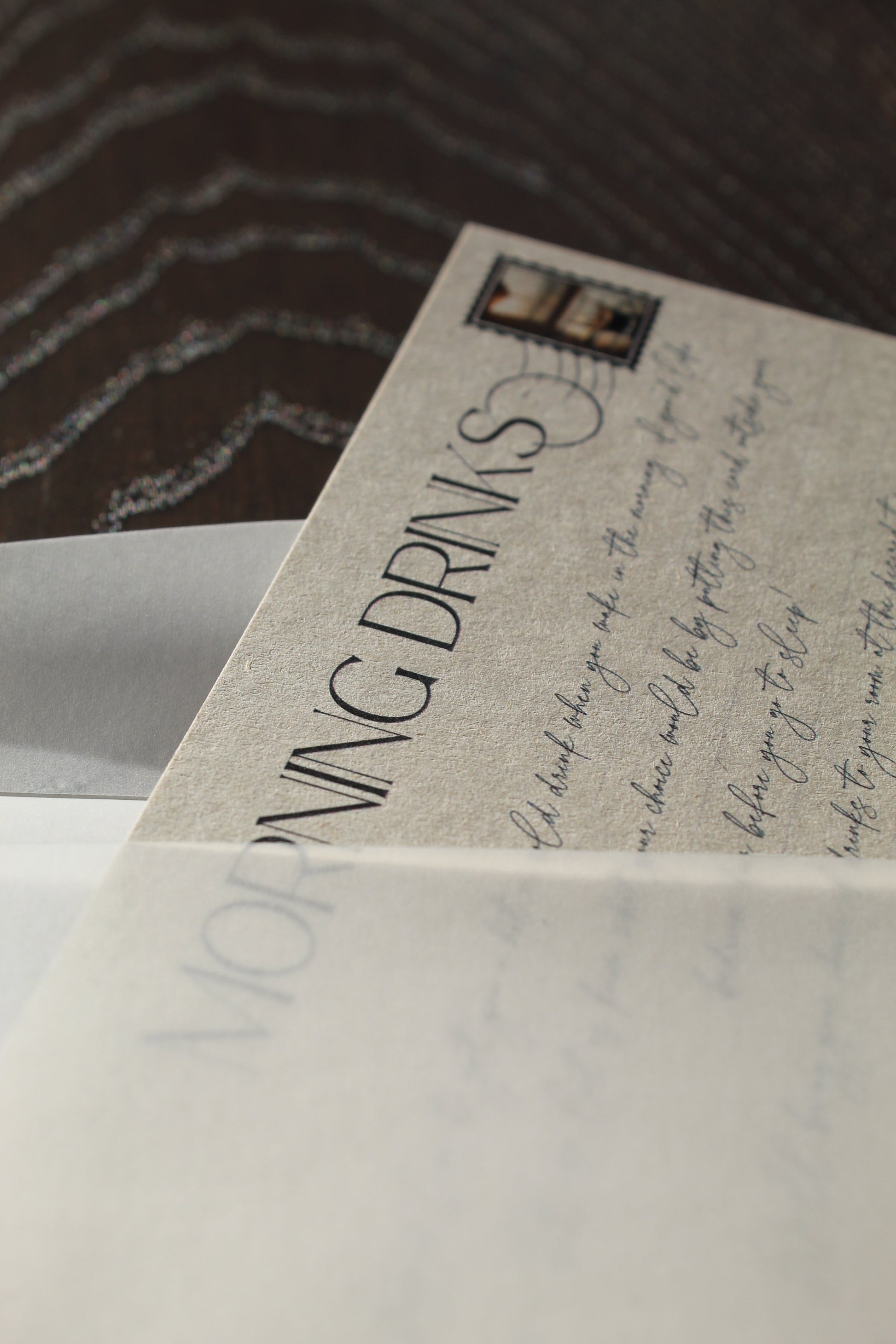 Close-up of a menu with text and a logo on a wooden surface
